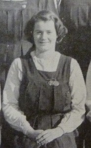 Monochrome image of teenage girl in school uniform, 1950s